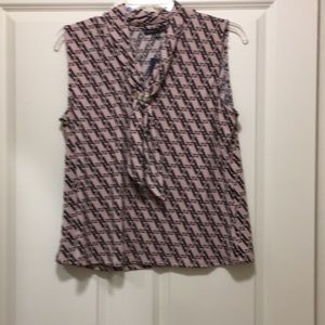 A very beautiful women blouse, sleeveless,colors are mauve and black